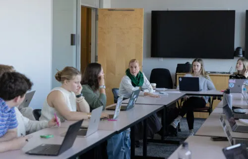Erinn Whitaker engages in a simulation on the use of drones in Pakistan in her first-year seminar.